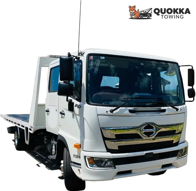 Front view of the white Hino crew-cab tilt tray that carried the Mustang from Wanneroo to Floreat