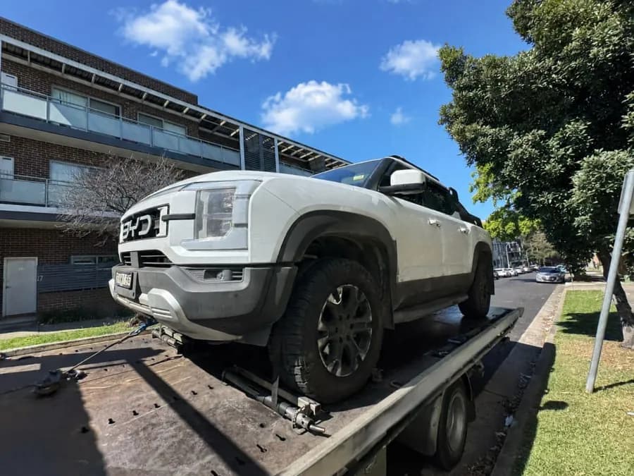 Quokka Towing tilt tray with a white BYD ute loaded on the deck