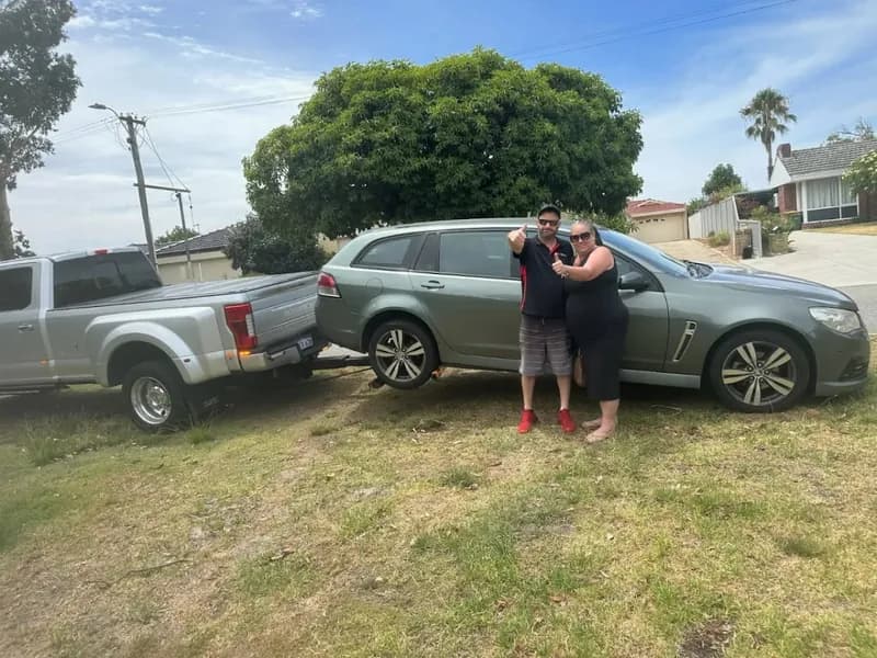 F-450 wheel-lift towing a grey Holden wagon