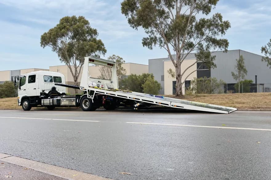 Quokka Towing tilt tray with its deck tipped down to the road, ready to load
